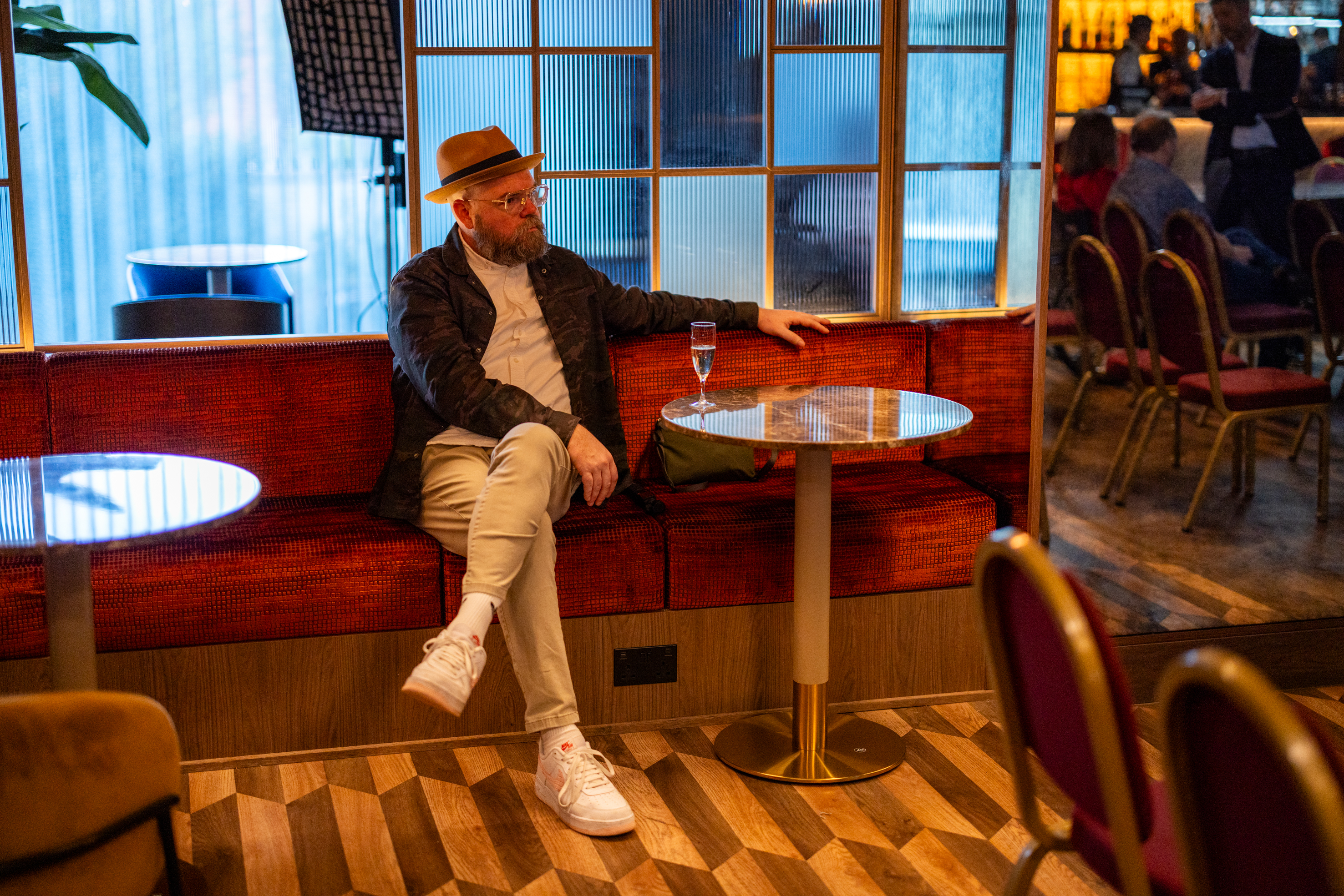 A man sitting in the restaurant booth